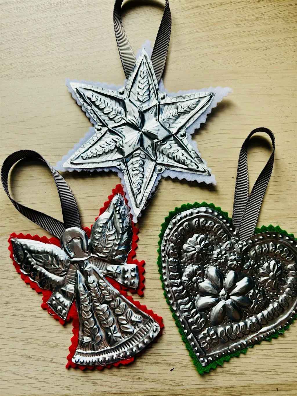 Metal embossed Christmas decorations at Shrewsbury Library
