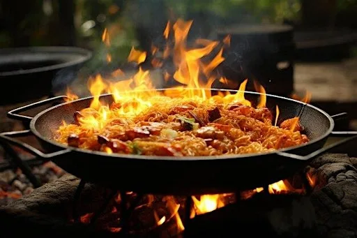 Tapas Night with chicken paella cooked over fire